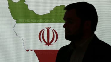 Stuart Davis, a director at one of FireEye's subsidiaries, stands in front of a map of Iran as he speaks to journalists about the techniques of Iranian hacking on Sept. 20, 2017 in Dubai. (AP)