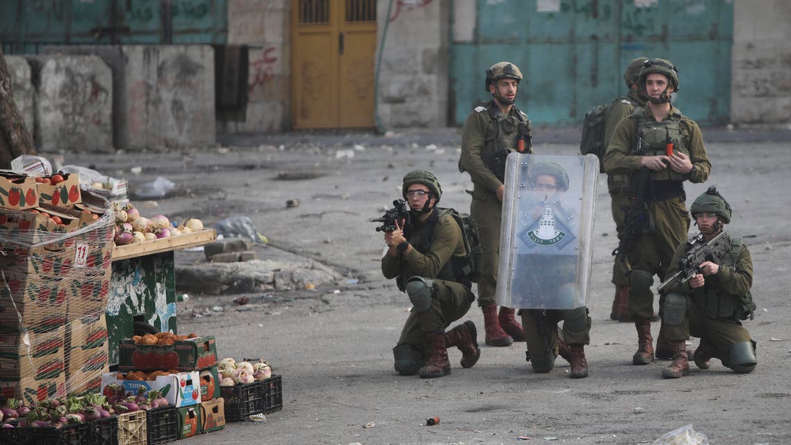 Israeli soldiers deploy during clashes with Palestinians as they protest the Mideast plan announced by the U.S. President Donald Trump, in Hebron, West Bank, Thursday, Jan. 30, 2020. (AP)