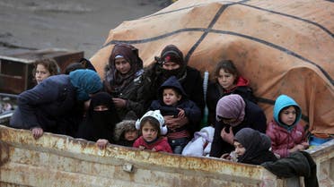 Syrians sit in the back of a truck as they flee the advance of the government forces in the province of Idlib on Jan. 30, 2020. (Photo: AP)