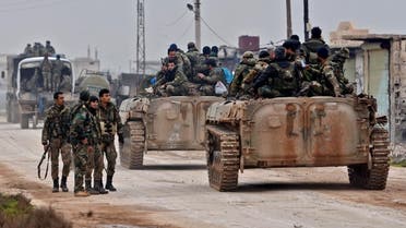 Syrian army soldiers advance in Tall Touqan village, in Syria's northwestern Idlib province, about 45 kilometres southwest of Aleppo, on February 5, 2020. (AFP)