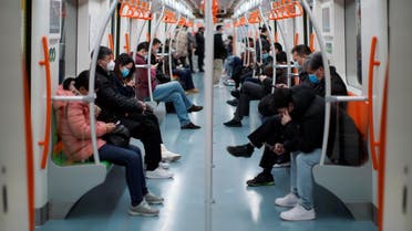 People wearing face masks ride a subway in the morning after the extended Lunar New Year holiday caused by the novel coronavirus outbreak, in Shanghai, China February 10, 2020. REUTERS