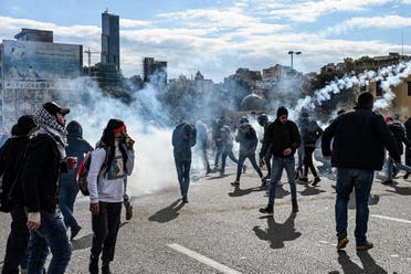 A protestor flees in incoming volley of tear gas. (Finbar Anderson)