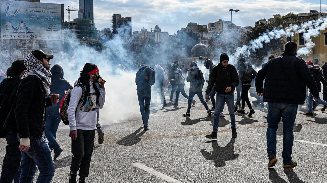 A protestor flees in incoming volley of tear gas. (Finbar Anderson)