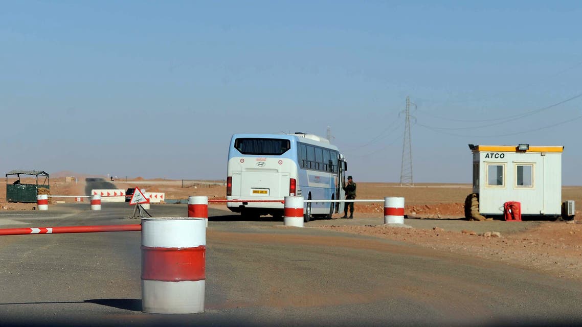 Algerian soldiers man a checkpoint near In Amenas deep in the Sahara near the Libyan border on January 19, 2013. Islamist gunmen killed seven foreign hostages in Algeria before being gunned down by special forces in a final assault on a remote desert gas complex, state television said. AFP PHOTO/FAROUK BATICHE
