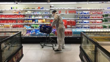 Customer pushes a cart while shopping inside a supermarket of Alibaba's Hema Fresh chain, following an outbreak of the novel coronavirus in Wuhan. (Reuters)
