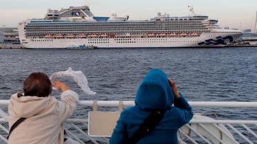 Tourists on a sightseeing cruise ship wave to passengers of the cruise ship Diamond Princess, which is anchored at Daikoku Pier Cruise Terminal in Yokohama, south of Tokyo, Japan February 12, 2020. (Photo: Reuters)