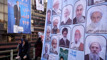 Women walk past electoral posters for the upcoming elections in central Tehran February 24, 2016. (Reuters)