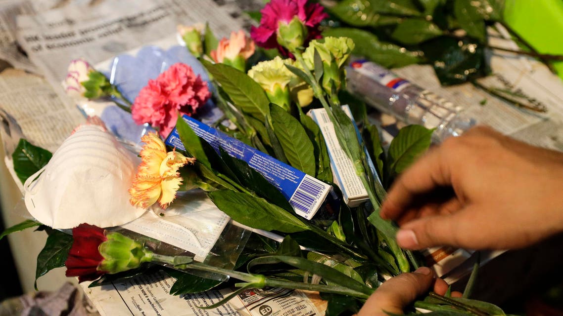 A man arranges a Valentines flower arrangement which they called "anti-nCoV bouquet" in Manila on Feb. 13, 2020. (AP)