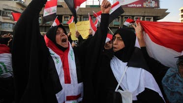 Iraqi women, followers of the cleric Moqtada al-Sadr, demonstrate among thousands of other supporters in the capital Baghdad’s Tahrir Square on February 14, 2020. (AFP)