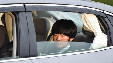A vehicle carrying Prince Hisahito, son of Prince Akishino and Princess Kiko, leaves the Imperial Palace in Tokyo on April 30, 2019. (AFP)