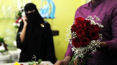 A florist prepares a Valentine's Day bouquet of flowers for a Saudi client at a flower shop in Jeddah on February 14, 2018. (AFP)