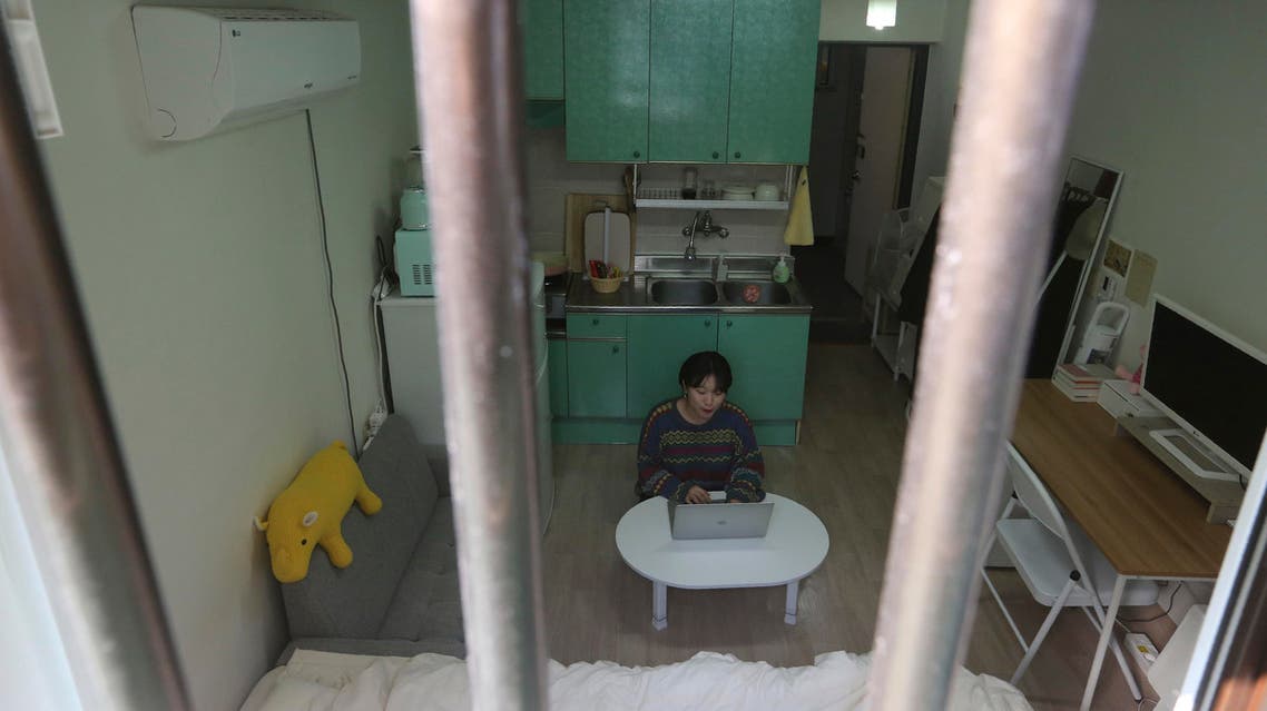 Kim Da-hye, a 29-year-old South Korean, sits with her laptop computer in her semi-basement apartment in Seoul, South Korea, Saturday, Feb. 15, 2020. (AP)
