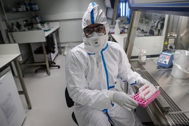 A laboratory operator at the National Reference Center (CNR) for respiratory viruses in Paris, which analyzes coronavirus samples. (File photo: AFP)