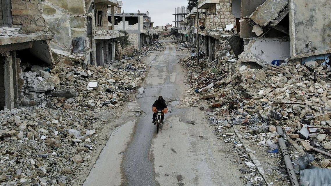 An aerial picture taken on February 15, 2020, shows a Syrian man on a motorbike in the deserted Syrian city of Kafranbel, south of Idlib city in the eponymous northwestern province, amid an ongoing pro-regime offensive. (AFP)