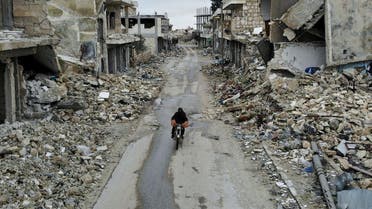 An aerial picture taken on February 15, 2020, shows a Syrian man on a motorbike in the deserted Syrian city of Kafranbel, south of Idlib city in the eponymous northwestern province, amid an ongoing pro-regime offensive. (AFP)