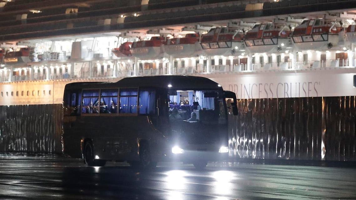 Buses carrying American passengers from the quarantined Diamond Princess cruise ship leave a port in Yokohama, near Tokyo. (AP)