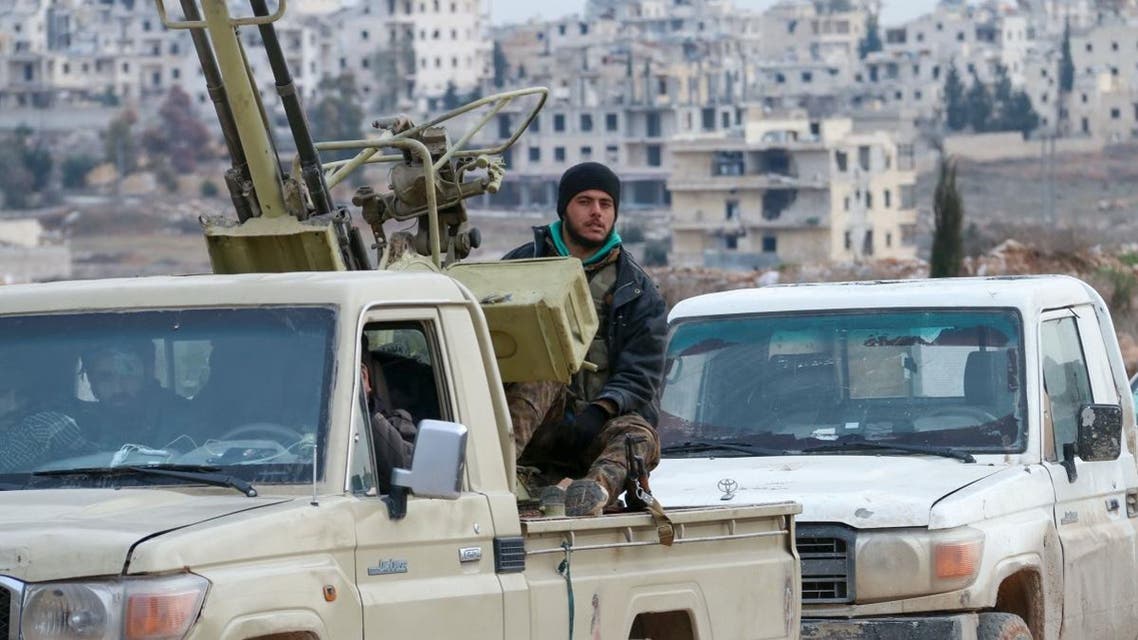 Syrian pro-government troops advance in the Tall Shwayhneh area towards the New Aleppo neighbourhood, west of Aleppo city. (AFP)