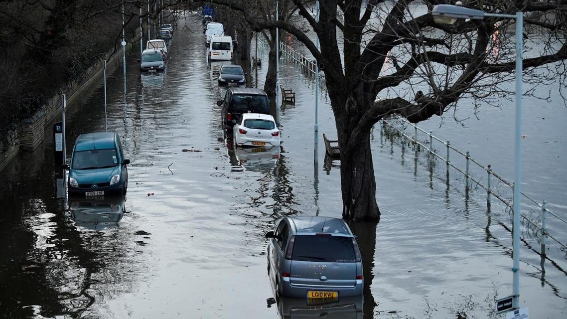 Cars are surrounded by water on a flooded road beside the River Thames in west London, Britain, February 12, 2020. (Photo: Reuters)
