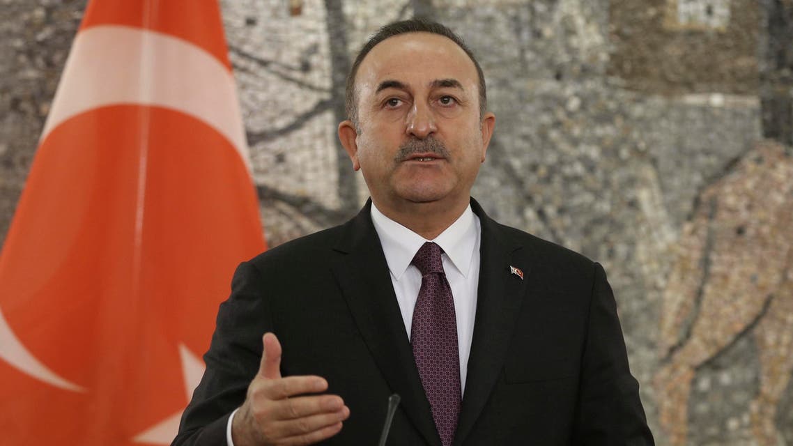 Turkey's Foreign Minister Mevlut Cavusoglu speaks during a joint news conference with Montenegro's Foreign Minister Srdjan Darmanoviç after their talks in Podgorica, Montenegro, Tuesday,. Feb. 11, 2020. (Turkish Foreign Ministry via AP, Pool)