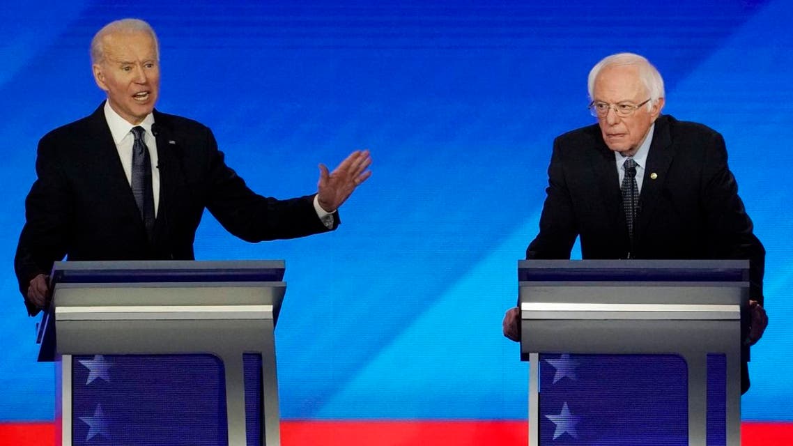 Democratic 2020 US presidential candidate and former VP Joe Biden speaks as Senator Bernie Sanders listens during the eighth Democratic 2020 presidential. (File photo: Reuters)