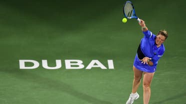 Kim Clijsters of the Belgium serves the ball to Garbine Muguruza of Spain during the WTA Dubai Duty Free Tennis Championship. (AFP)