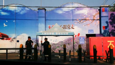 Security guards stand at the gates of what is officially known as a vocational skills education centre in Huocheng County. (Reuters)