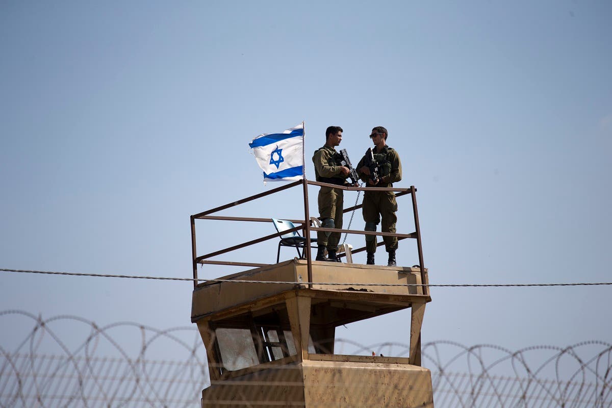  Israeli soldiers guard on top of a watch tower in a community along the Israel- Gaza Strip Border. (File photo: AP)