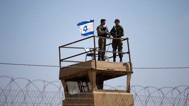 A file photo of Israeli soldiers guard on top of a watch tower in a community along the Israel- Gaza Strip Border. (File photo: AP)