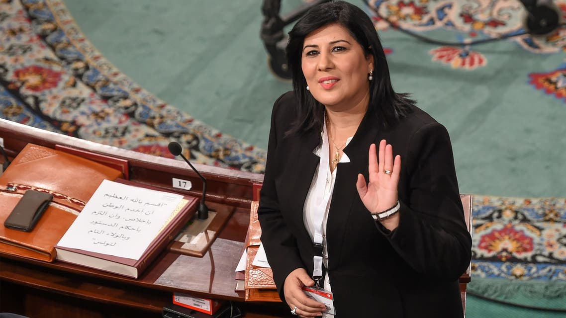 The leader of the Free Destourian Party (PDL) Abir Moussi waves as she attends the first session of parliament following October elections on November 13, 2019 in the Tunisian capital Tunis, calling it unconstitutional. Newly elected members of parliament gave a collective oath, whereas Moussi wanted them to swear one by one, and claimed some of them were not in the room at the time of the oath. It is the first clash on the floor of the Assembly between the anti-islamist lawyer Moussi and the leader of the Islamist-inspired Ennahdha party, Rached Ghannouchi, who hopes to be the new president of the Assembly.