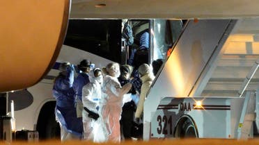 American evacuees from the coronavirus outbreak in China board a bus after arriving by flight to Eppley Airfield in Omaha, Neb. (AP)