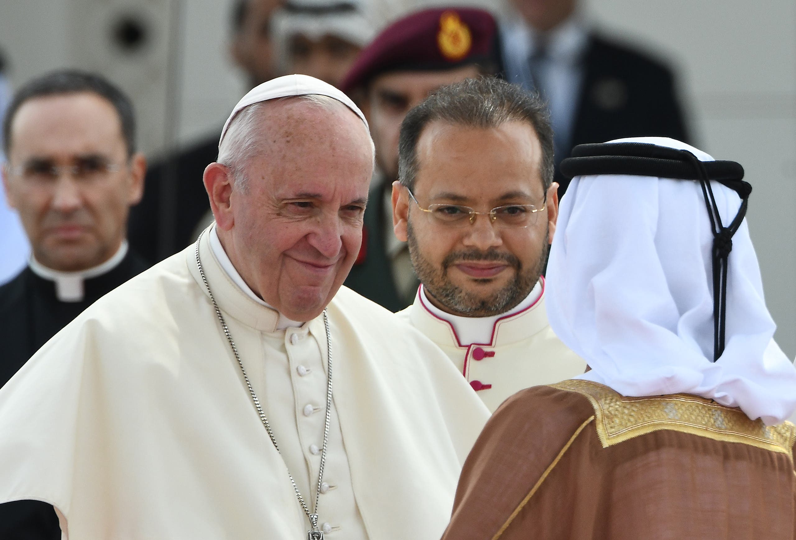 Pope Francis (L) shakes hands with a dignitary as he is accompanied by Abu Dhabi's Crown Prince Sheikh Mohammed bin Zayed al-Nahyan (R) during his welcome ceremony at the presidential palace in the UAE capital Abu Dhabi on February 4, 2019. (AFP)