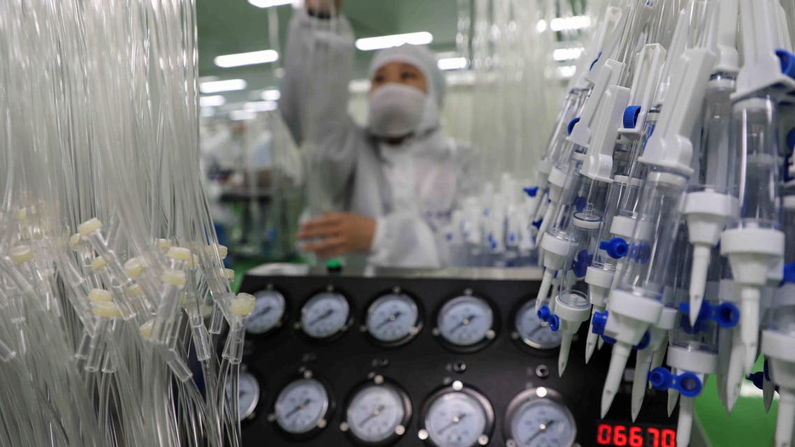 This photo taken on February 13, 2020 shows workers producing medical supplies at a factory in Binzhou in China's eastern Shandong province. (AFP)
