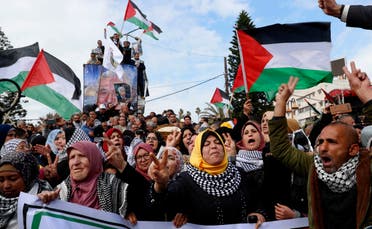 Protestors wave Palestinian flags in Gaza City on Feb. 11, 2020. (AP)