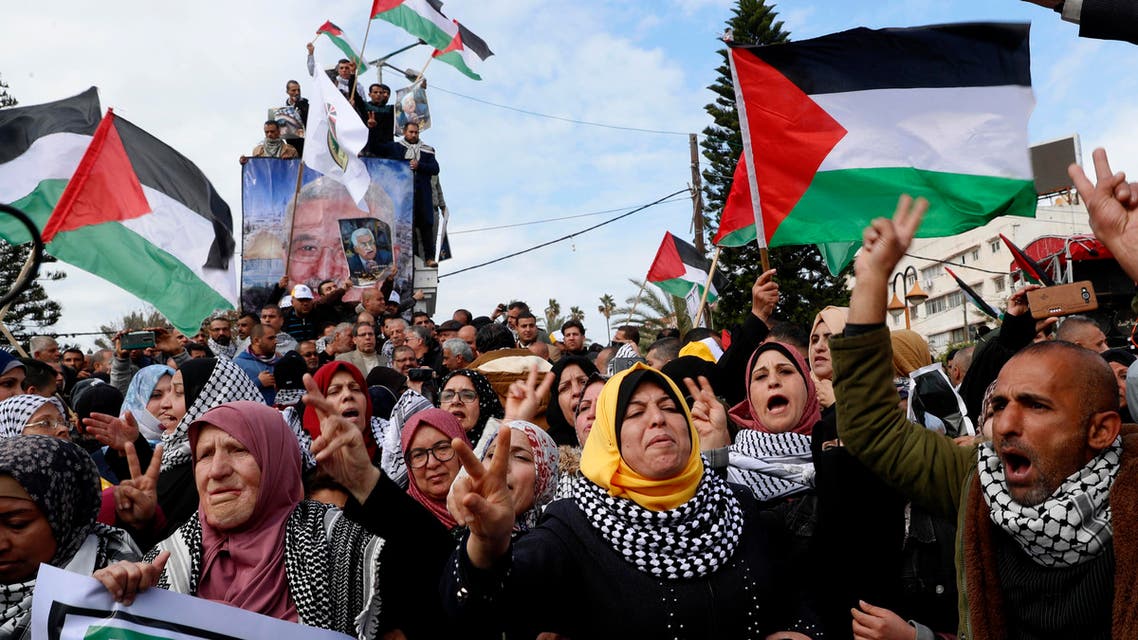 Protestors wave Palestinian flags in Gaza City on Feb. 11, 2020. (AP)