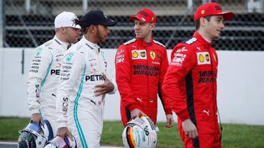 Ferrari’s Sebastian Vettel speaks to Mercedes’ Valtteri Bottas and Lewis Hamilton alongside Ferrari’s Charles Leclerc before testing at the Circuit de Barcelona-Catalunya, Barcelona, Spain, on February 19, 2020. (Reuters)