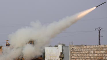 Turkish soldiers fire a missile at Syrian government position in the province of Idlib on Feb. 14, 2020. (AP)
