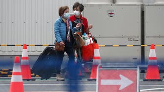 Virus-hit cruise ship passengers disembark in Japan after two-week quarantine 