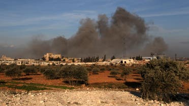 This picture taken on February 20, 2020 shows smoke plumes rising following a reported air strike near a Turkish military observation point between the northwestern Syrian city of Idlib and the neighbouring town of Qaminas. (AFP)