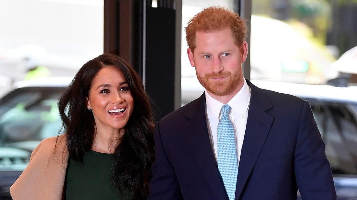 Britain's Prince Harry, Duke of Sussex (R), and his wife Meghan, Duchess of Sussex attend the annual WellChild Awards in London on October 15, 2019. (AFP)