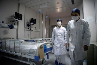 Nurses walk inside a quarantine room for coronavirus patients at finished but still unused building A2 of the Shanghai Public Clinical Center, in Shanghai, China February 17, 2020. (Reuters)