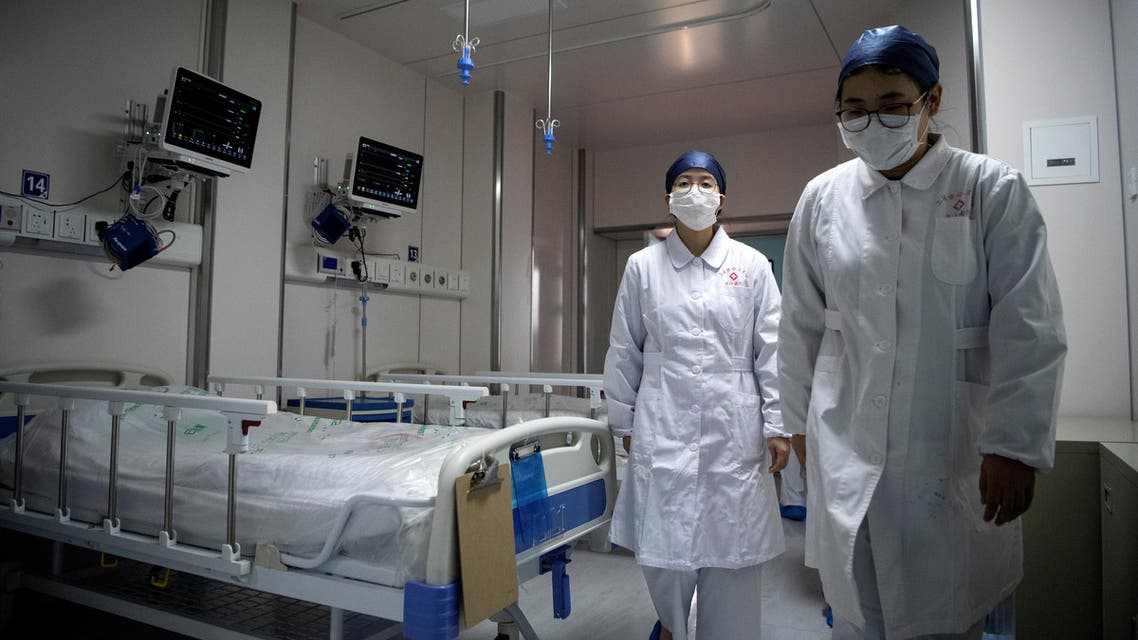 Nurses walk inside a quarantine room for coronavirus patients at finished but still unused building A2 of the Shanghai Public Clinical Center, in Shanghai, China February 17, 2020. (Reuters)