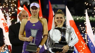 Romania's Simona Halep poses with a trophy after winning the final alongside runner up Kazakhstan's Elena Rybakina. (Reuters)