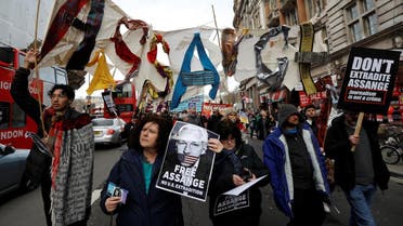 Demonstrators protest against the extradition of Julian Assange, in London. (Reuters)