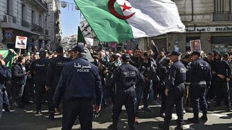 Thousands of Algerians hit streets of capital on protest movement anniversary 