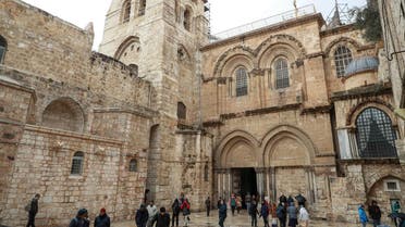 People walk outside the Church of the Holy Sepulchre in the Old City of Jerusalem on January 21, 2020. (AFP)