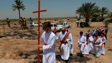 Iraqi Christians attend Mass at the archaeological site of Kokheh Church south of Baghdad on Aug 23, 2019. (AP)