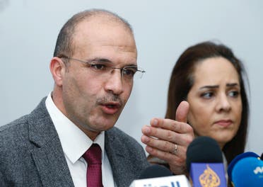 Lebanon's Minister of Health, Hamad Hasan and Iman Shankiti, WHO representative in Lebanon, attend a news conference, after the country's first case of the novel coronavirus was confirmed, in Beirut, Lebanon February 21, 2020.  (Reuters)