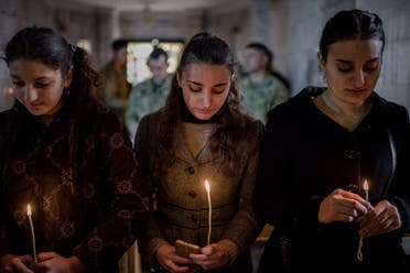 Iraqis attend mass in Bartella on December 24, 2016. (File photo: AP)