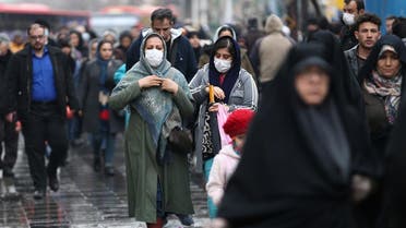 Iranian women wear protective masks to prevent contracting a coronavirus, as they walk at Grand Bazaar in Tehran, Iran February 20, 2020. (Reuters)