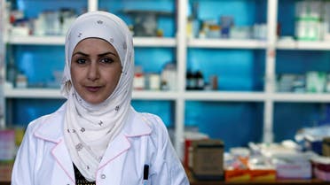 Hannaa Jassem, 24, an Iraqi nurse poses for a photo at her work in Baghdad, Iraq January 12, 2020. (Reuters)